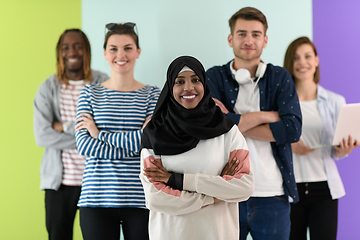 Image showing group of diverse teenagers posing in a studio, determined teenagers in diverse clothing.