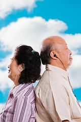 Image showing Senior asian couple listening to music