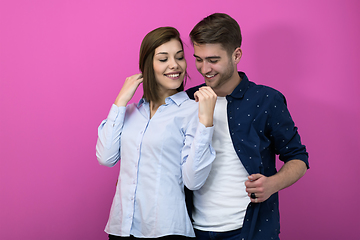 Image showing couple dancing in front of a pink background