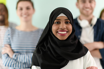 Image showing group of diverse teenagers posing in a studio, determined teenagers in diverse clothing.