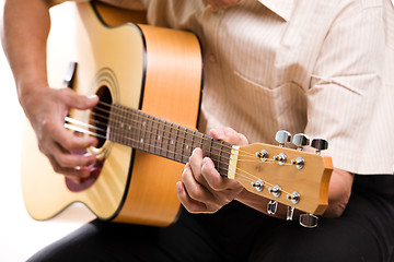 Image showing Senior man playing guitar