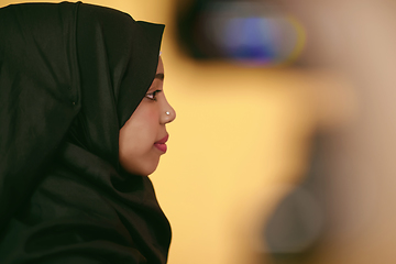 Image showing muslim woman with a beautiful smile wearing a hijab poses in the studio