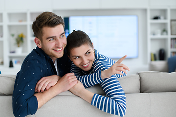 Image showing a young married couple enjoys sitting in the large living room