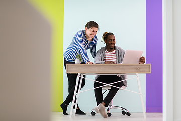 Image showing merican and a young girl plan meetings together and use a laptop for an online meeting