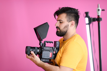 Image showing cameraman with professional equipment shoots video clips