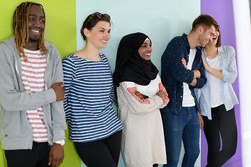 Image showing group of diverse teenagers posing in a studio, determined teenagers in diverse clothing.