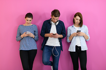 Image showing group of friends have fun and dance while using a cell phone and headphones