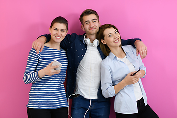 Image showing group of friends have fun and dance while using a cell phone and headphones