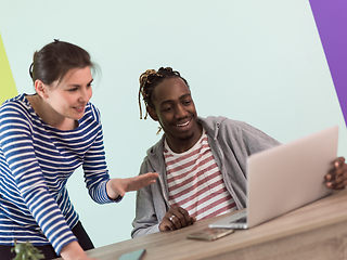 Image showing merican and a young girl plan meetings together and use a laptop for an online meeting