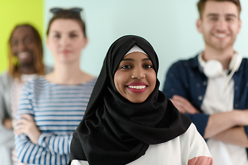 Image showing group of diverse teenagers posing in a studio, determined teenagers in diverse clothing.