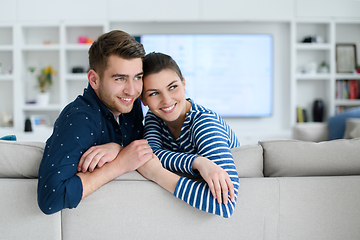 Image showing a young married couple enjoys sitting in the large living room