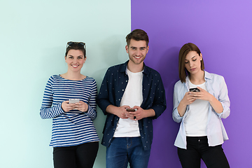 Image showing a group of teenagers use mobile devices