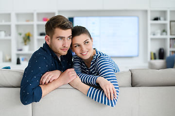 Image showing a young married couple enjoys sitting in the large living room