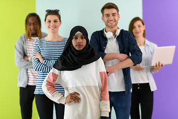 Image showing group of diverse teenagers posing in a studio, determined teenagers in diverse clothing.