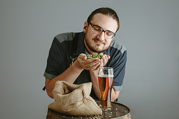 Image showing Confident young male brewer with self crafted beer