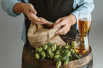 Image showing Close up of confident senior man brewer with self crafted beer