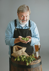 Image showing Confident senior man brewer with self crafted beer