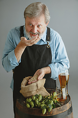 Image showing Confident senior man brewer with self crafted beer