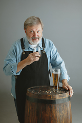 Image showing Confident senior man brewer with self crafted beer