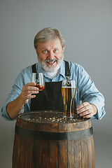 Image showing Confident senior man brewer with self crafted beer