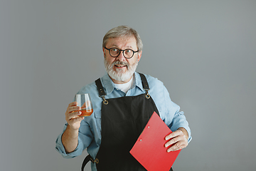 Image showing Confident senior man brewer with self crafted beer