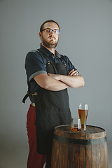 Image showing Confident young male brewer with self crafted beer