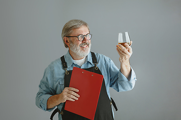 Image showing Confident senior man brewer with self crafted beer