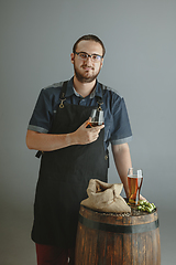 Image showing Confident young male brewer with self crafted beer