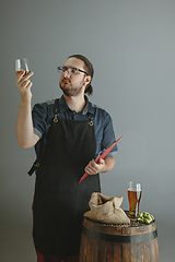 Image showing Confident young male brewer with self crafted beer