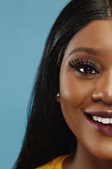 Image showing African-american young woman\'s close up portrait on studio background