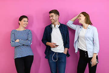 Image showing group of friends have fun and dance while using a cell phone and headphones