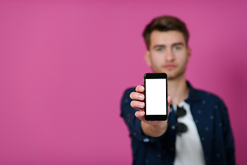 Image showing covid passport a young man shows his qr code and covid19 passport on his cell phone