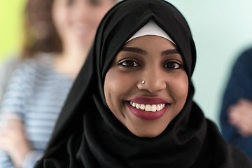 Image showing group of diverse teenagers posing in a studio, determined teenagers in diverse clothing.