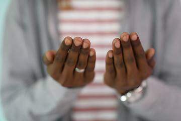 Image showing Young African Muslim Man Making Traditional Fatiha Prayer To Allah