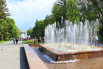 Image showing People have a rest in city park with fountains