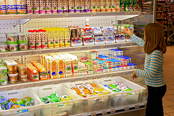 Image showing girl in shop of dairy products