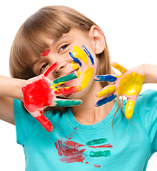 Image showing Portrait of a cute girl playing with paints