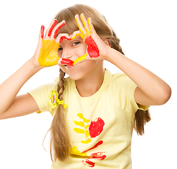 Image showing Portrait of a cute girl playing with paints