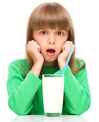 Image showing Cute little girl with a glass of milk