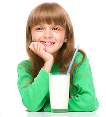 Image showing Cute little girl with a glass of milk