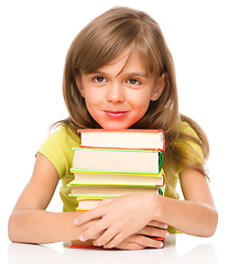 Image showing Little girl with her books
