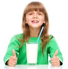 Image showing Cute little girl with a glass of milk