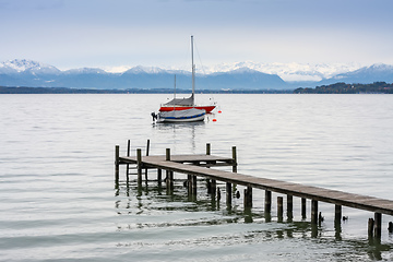 Image showing Starnberg lake jetty and boats Alps in winter season