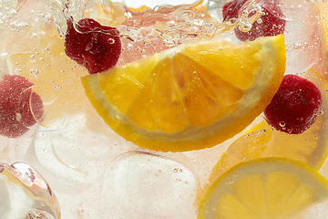 Image showing Close up view of the lemon slices in lemonade on background