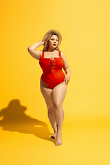 Image showing Young caucasian plus size female model\'s preparing for beach resort