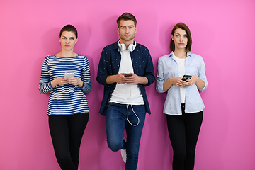 Image showing group of friends have fun and dance while using a cell phone and headphones