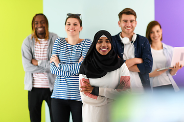 Image showing group of diverse teenagers posing in a studio, determined teenagers in diverse clothing.