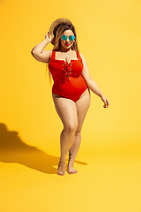 Image showing Young caucasian plus size female model\'s preparing for beach resort