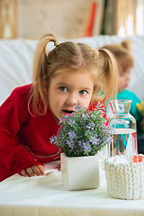 Image showing Little girls in soft warm pajamas playing at home