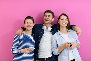 Image showing group of friends have fun and dance while using a cell phone and headphones